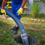 A man showing how to pump septic tank